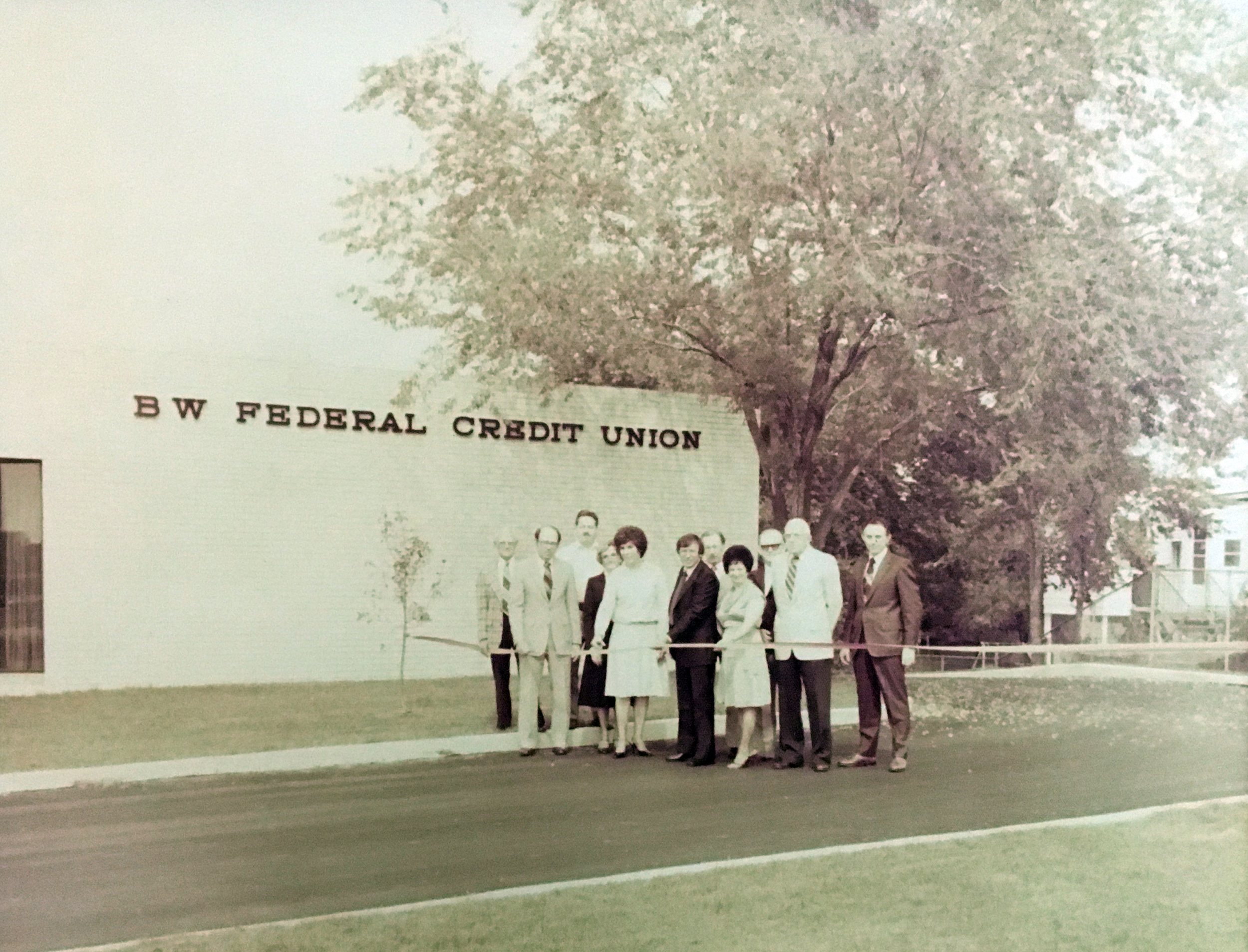 Image: Old photo of a ribbon cutting at BWFCU